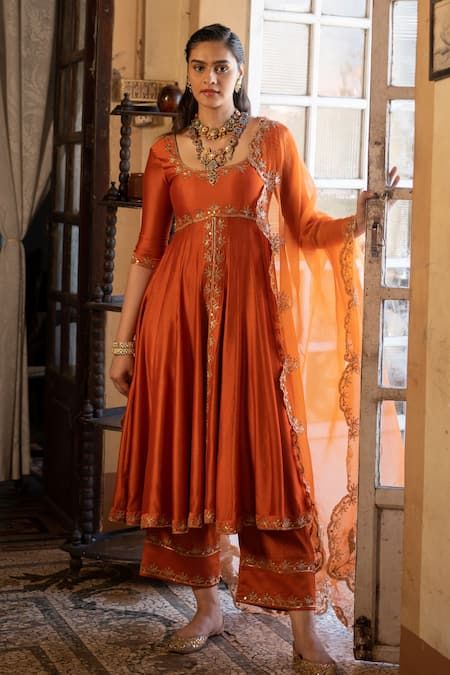 Buy Orange Anarkali And Pant Chiniya Silk Embroidery Zari U Neck Set For Women by Paulmi and Harsh Online at Aza Fashions. Elegant Anarkali Suits, Ethnic Anarkali Dresses, Tissue Anarkali Dress, Embroidery On Orange Fabric, Tissue Fabric Dress Design, Silk Dresses Indian, Rust Orange Lehenga, Mehndi Gharara, Wedding Guests Outfits