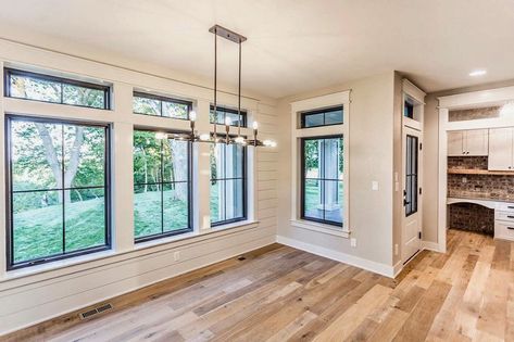 Custom-designed Pella® Impervia® windows visually connect the dining room and the kitchen in this modern farmhouse. Crafted of our highly durable fiberglass, these windows bring in abundant natural light—and natural beauty. Black Window Trims, Farmhouse Trim, Black Window Frames, Pella Windows, Black Window, Farmhouse Windows, Interior Windows, White Windows, Black Windows