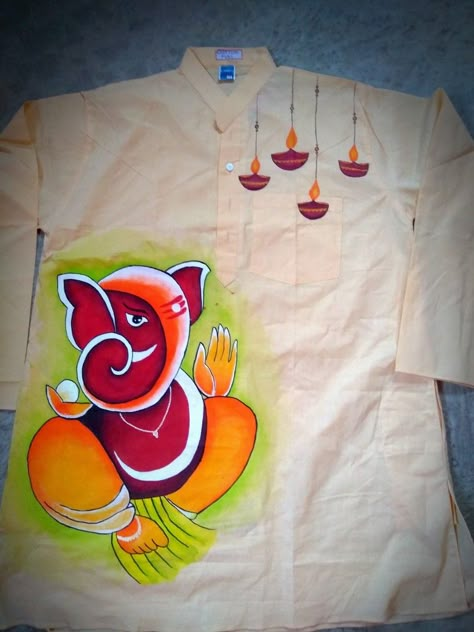 Fabric printing of ganesh and diya on cotton Panjabi. Ganesh Fabric Painting, Fabric Penting Blouse, Ganpati Fabric Painting, Febric Penting Design Panjabi, Kurta Fabric Painting, Panjabi Fabric Painting, Punjabi Design, Embroidery Shirt Men, Punjabi Art