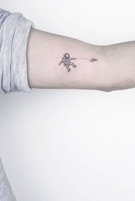 70+ Small and Adorable Tattoos by Ahmet Cambaz from Istanbul - TheTatt Cute Astronaut Tattoo, Minimalist Tattoo Space, Astraunaut Tattoo, Small Rocket Tattoo, Small Astronaut Tattoo Simple, Small Space Tattoos, Small Spaceman Tattoo, Small Cool Tattoos For Guys, Tiny Astronaut Tattoo