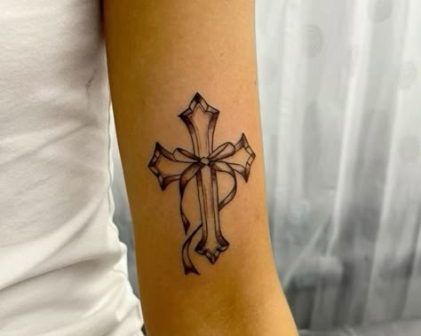 Cross With Ribbon Tattoo Design, Cross With Bow Tattoo, Cross Y2k Tattoo, Cross Bow Tattoo, Delicate Cross Tattoo, Cross Tattoo Aesthetic, Y2k Arm Tattoos, Y2k Cross Tattoo, Cross Tattoo Outline