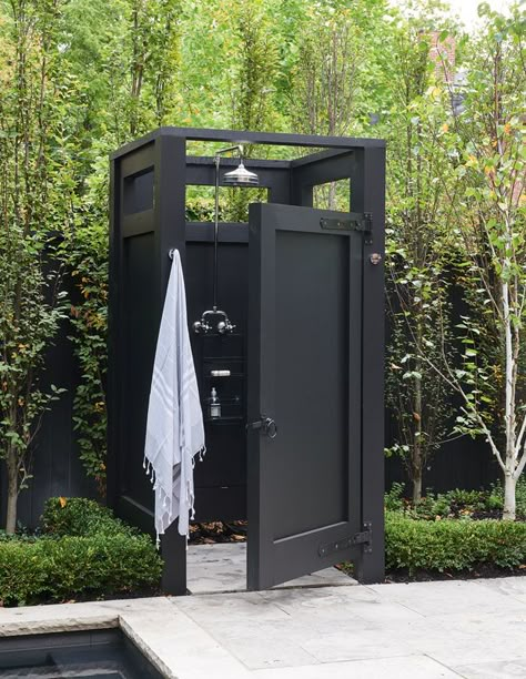 11 Outdoor Showers That Will Elevate Your Morning Routine - House & Home Pool Bathrooms Outdoor, Enclosed Outdoor Shower Ideas, Outdoor Shower Towel Storage, Outdoor Swimming Pool Shower Ideas, Barndominium With Outdoor Living, Outdoor Pool Shower And Toilet, Swimming Pool Shower Outdoor, Outdoor Shower For Pool, Boho Outdoor Shower Ideas