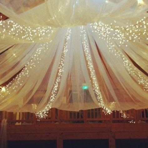 Do you enjoy the look of tulle and lights together? If so, we give you ideas on how you can create this look in your home! Tulle Lights, White Lights, Future Mrs, Fairytale Wedding, Great Gatsby, Some Day, Here Comes The Bride, My Dream Wedding, Gatsby