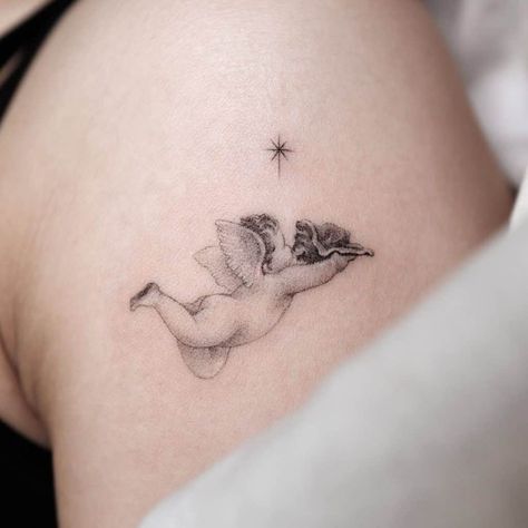 Best Baby Angel Tattoo Designs 3 Flying Cherub Tattoo, Baby Cherub Tattoo, Sleeping Angel Tattoo, Cupid Tattoo Design, Heavenly Tattoo, Cherub Tattoos, Simple Angel Tattoos, Cherubs Tattoo, Angel Baby Tattoo