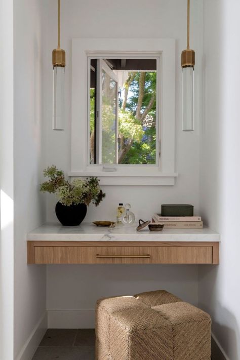 The Ainsley Stool from the @kirk_nix collection adds natural texture and comfort to this vanity nook. Its low profile makes it the perfect complement to small spaces where it can be easily tucked away when not in use.  #Palecek // @kirk_nix Collection // Design: @emerson.gracedesign // Photography: @jessicabrydsonphotograph Oak Makeup Vanity, Built In Makeup Vanity Ideas, Nook Vanity, Makeup Nook, Built In Makeup Vanity, Vanity Nook, Corner Vanity, Dining Table Lighting, Chandelier Table Lamp