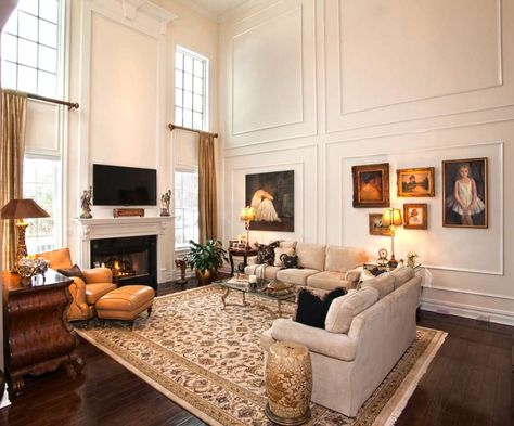 Tall, Two-Story windows with thick trim and wainscoting outlines. Tall Wall Trim, Family Room Trim Ideas, Two Story Wainscoting Family Rooms, Two Story Living Room Wall Moldings, Wainscoting Family Room, Wainscoting Tall Walls, Tall Wainscoting Ideas, Two Story Wall Decor Ideas, Family Room Wall Ideas