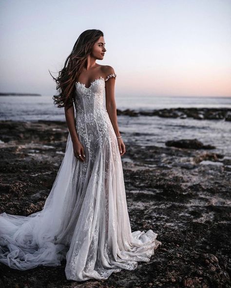 Calling all coastal brides who want a delicate and flirtatious wedding gown our #GALA203 is a stunning off-the-shoulder A-line princess wedding dress is made of sheer French lace and comes with a detachable tulle skirt.  Image: Tali Photography Estilo Rachel Green, Bohemian Wedding Dress Lace, Lace Applique Wedding Dress, Off Shoulder Wedding Dress, Applique Wedding, Applique Wedding Dress, Bohemian Wedding Dress, Illusion Neckline, Gowns With Sleeves