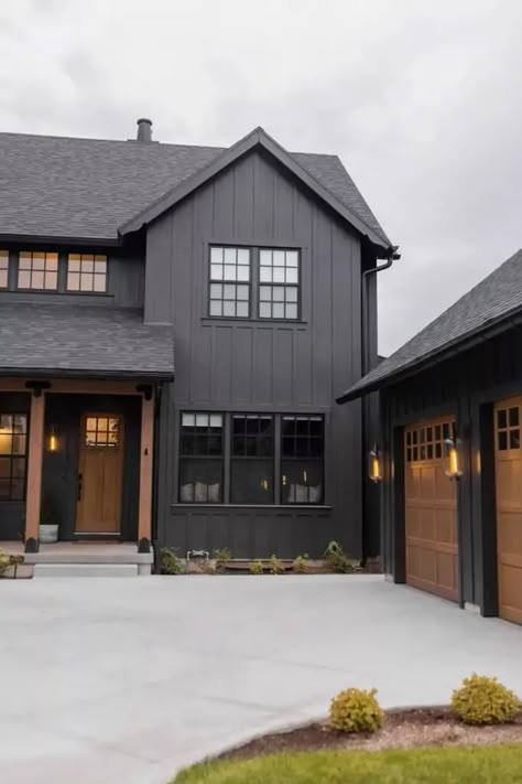 Black Siding Farmhouse Exterior, Black Siding Wood Accents, Wood Tone House Interior, Grey House Black Trim Wood Accents, Dark Cabin Exterior Colors, Black House Ideas Exterior Paint, Dark Brown House With Black Trim, New Farmhouse Exterior, Bold Home Exterior Colors