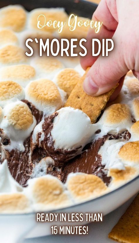 Close-up of a skillet filled with melted chocolate topped with toasted marshmallows and a graham cracker being dipped into it. Smores Dessert Dip, Smores Dip Recipe, Melted Chocolate Chips, Skillet Desserts, Dessert Dip Recipes, Smores Dip, Smores Dessert, Smore Recipes, Appetizer Dessert