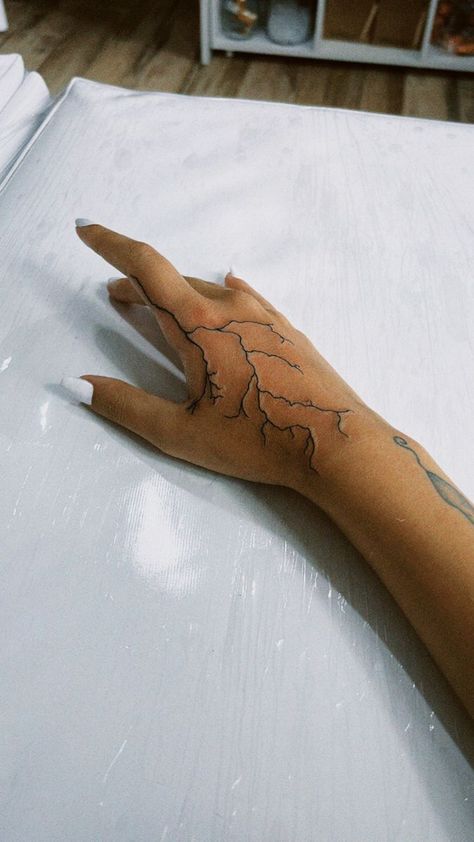 250+ Lightning Tattoos Ideas and Designs (2023) - TattoosBoyGirl Electricity Hand Tattoo, Hand Tattoos Lightning Bolt, Lightning On Hand Tattoo, Lightning Tattoo Men Hand, Hand Lighting Tattoo, Hand Tattoos For Women Lightning, Lightening Hand Tattoos, Lighting Tattoo Arm Sleeve, Lighting On Hand Tattoo