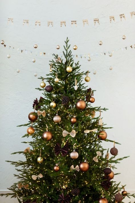 How To Put Lights On Your Christmas Tree For Maximum Twinkle Xmas Ornaments Diy, Copper Christmas Decor, Christmas Tree Game, Best Christmas Tree Decorations, Best Artificial Christmas Trees, Copper Ornaments, Christmas Quiz, Copper Christmas, Front Door Wreaths