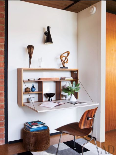 Finding room for a desk in your small space can be a challenge. And when you’re trying to get motivated to accomplish a task or two at home, the last thing you need is another obstacle. So if you’re low on square footage, a wall-mounted desk or built-in work surface can be a great space-saving solution, providing roughly the same work area with a smaller footprint. Whether you prefer a surface built into existing storage, a simple plank that drops down from a wall-mounted shelf, or a table th... Small Bedroom Desk, Fold Down Desk, Space Saving Desk, Interior Design Per La Casa, Small House Interior, Small House Interior Design, Wall Mounted Desk, Small Bedroom Designs, Bedroom Desk