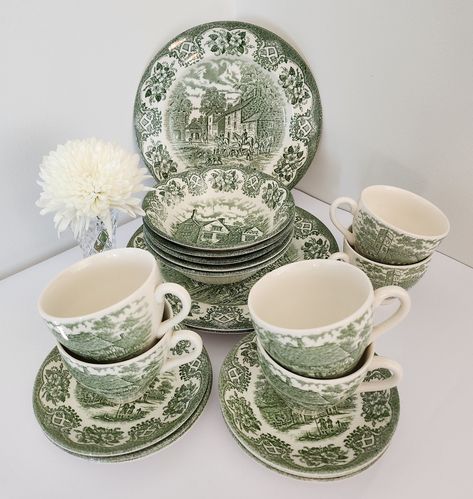 These beautiful vintage English Ironstone Tableware Ltd replacement pieces are white with green "Inn Series" country life transferware images. In good pre-owned condition except for one dinner plate which has a scratch, and one cup with marks on the inside (see photos). Pieces sold individually: 5x Soup Bowls 16cm dia. 3x Dinner Plates 24cm dia. 2x Side Plates 17.5cm dia. 5x Teacups 9cm dia. 6x Saucers 14cm dia. A lovely addition to any collection or perfect for adding a touch of retro elegance Green Vintage Dishes, China Sets Vintage, Cute Dishware, Green Plates Table Setting, Green Tableware, Green Dishes, Green Transferware, Corningware Vintage, Ironstone Collection