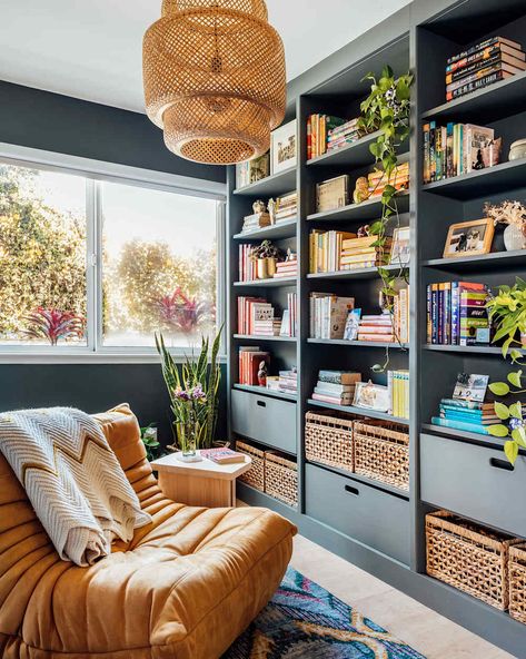 Painted bookshelf in home library. Dark Blue Billy Bookcase, Billy Bookcase Reading Nook, Home Library Billy Bookcase, Bookshelf Wall With Ladder, Living Rooms With Bookshelves, Bookshelf Around Door, Billy Bookcase Kids Room, Built In Corner Shelves Living Room, Built In Ikea Bookshelves