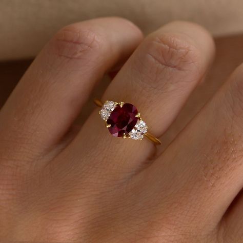 Falling in Love with rubies? This ring is available online ♥️♥️ Moonlight Setting 1.42ct Ruby Oval cut 18k Recycled Gold £5,760 with VAT Available Online #rubyring #engagementring #redruby #rubyengagementring #uniquering #engaged Single Ruby Ring, 3 Stone Ruby And Diamond Ring, Vintage Engagement Rings Ruby, Engagement Rings Moon, Art Deco Engagement Ring Ruby, Engagement Rings Ruby, Ruby Engagement Rings, Ruby Ring Designs, Ruby Diamond Engagement Ring