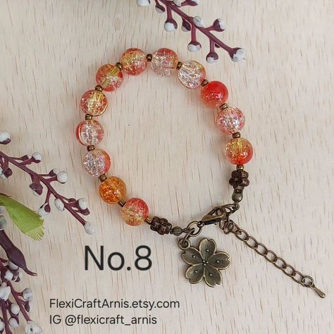 FALL AUTUMN beaded bracelet No.8 10mm crackle glass beads Spacer using 3mm bronze color glass seed beads. Measurement: 7 inch + 2 inch extender chain (adjustable) Buy from my Etsy shop: https://flexicraftarnis.etsy.com/listing/1794851842 #beading #beadedbracelets #beadedbracelet #glassbeads Crackle Glass, No 8, Glass Seed Beads, Bronze Color, Fall Autumn, Beaded Bracelet, Seed Beads, Beading, Glass Beads