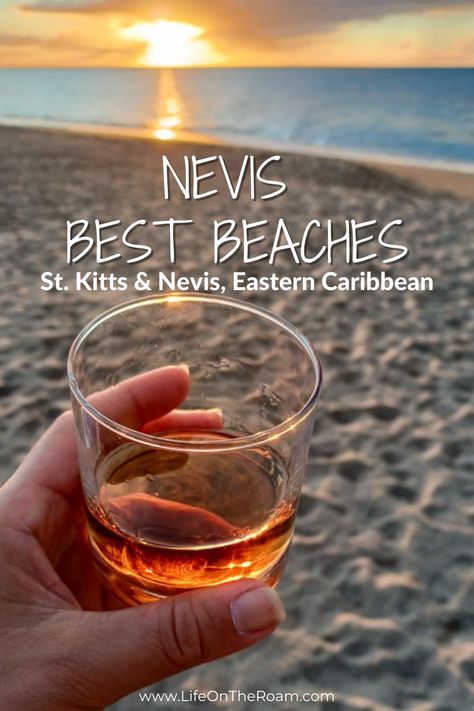 A sandy beach at sunset with a glass of rum in the foreground and the text "Nevis Best Beaches-St Kitts & Nevis, Eastern Caribbean" Nevis Island, Caribbean Island, Beach Getaway, Caribbean Travel, Amazing Sunsets, Booking Flights, Beach Paradise, Windsurfing, Beach Getaways