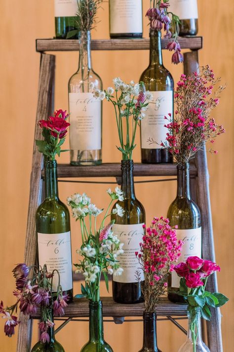 Wine Bottle Bud Vase Wedding, Decoration With Wine Bottles, Recycled Wine Bottles Wedding, Wedding Inspo Romantic Rustic, Wine Bottle Table Centerpieces, Display Wine Bottles, Plant In Wine Bottle, Wine Bottle With Flowers Centerpieces, Rustic Wine Bottle Centerpieces