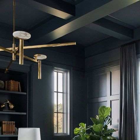 Visual Comfort & Co. on Instagram: "We’re dreaming of this moody home office featuring dark blue millwork, handsomely styled bookshelves, and a coffered ceiling. 😌💭 Our Melange Large Floating Disc Chandelier by Kelly Wearstler, composed of unique configurations in brass and carved natural alabaster shades, crowns the stunning space designed by @providenceinteriors.  📷: @allisonelefantephoto" Moody Home Office, Styled Bookshelves, Disc Chandelier, Blue Home Offices, Moody Home, Blue Paint Color, Dark Ceiling, Blue Office, Sunshine Love