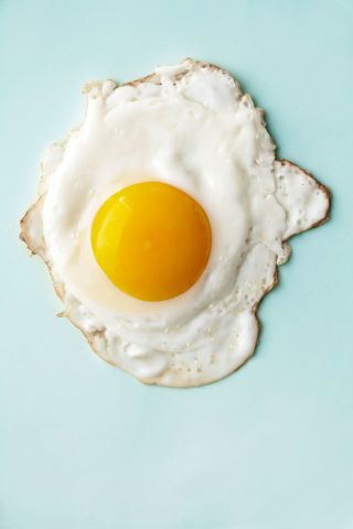 Heat 1 Tbsp canola oil in a large nonstick skillet over medium heat. Crack each egg into a small cup, then gently slip eggs into skillet and cook over medium-low heat 1 minute. Cover skillet and cook about 5 minutes, until white is set. Egg Recipes For Dinner, High Cholesterol Foods, Sunnyside Up Eggs, Food References, Cholesterol Foods, How To Make Eggs, Food Reference, Over Easy Eggs, Perfect Eggs