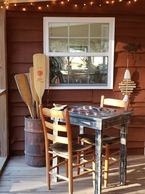 Rustic river cabin porch Rustic River House, Rustic Cabin Home Ideas, Ll Bean Home Style, Small Lake Cottage Interiors Area Rugs, River Airbnb Decor, Rustic River Cabin, Outdoor Cabin Decorating Ideas, Fish Camp Cabin, Fishing Lodge Decor Lake Cabins