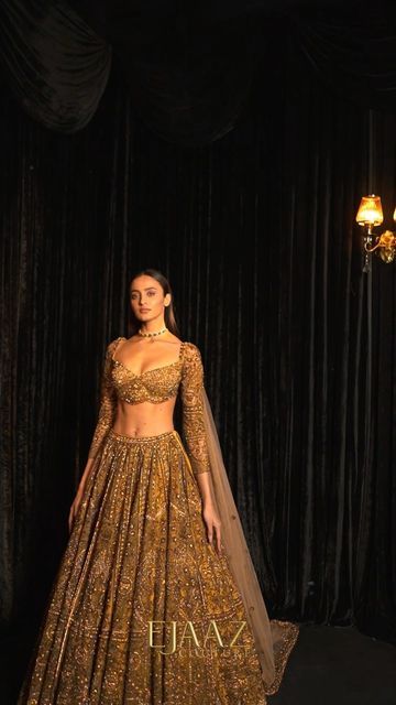 Ejaaz Couture on Instagram: "Hold your breath, or this treasured gold lehenga shall certainly take it away. Glamour is in the details of our gold finery, embellished in crystals and celebratory elements. 𝘚𝘌𝘈𝘚𝘖𝘕’𝘚 𝘋𝘐𝘈𝘔𝘖𝘕𝘋𝘚 Celebratory Couture 2022 Jewelry by @kotawalajewels — Shop with us: ⚜️at our Flagship Store : D 33, First Floor, Defence Colony, New Delhi - 110024 ⚜️Whatsapp : +91-9873789288 ⚜️Website : Link in the bio ⚜️Virtual Consultant : +91-9873789288 For inquiries & appoi Ejaaz Couture, Golden Bridal Lehenga, Gold Lehenga, Latest Bridal Lehenga, Reception Lehenga, Reception Gown, Indian Bride Outfits, Indian Bridal Lehenga, Indian Bridal Dress