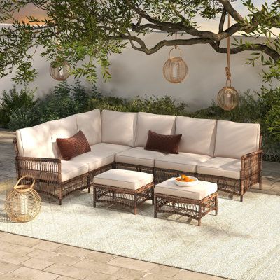 The perfect addition to any patio, deck, or sunroom, this all-weather wicker 6-person sectional seating set is made from durable, weather-resistant wicker and features plush, comfortable cushions. The set includes a sectional sofa and two ottomans. The modular design allows you to arrange the pieces in a variety of configurations to suit your needs. | Ebern Designs Direnzo 98" Wide Outdoor 6 - Person Outdoor Wicker L-Shaped Patio Sectional w / Cushions Wicker / Rattan in Brown | 32.7 H x 98 W x Rattan Sectional Sofa, Sunroom Sectional Sofa, Chic Patio Furniture, Outdoor Couches Patio, Deck Sectional, Deck Furniture Ideas, Patio Furniture Decor, Cozy Outdoor Seating, Patio Sectional Furniture