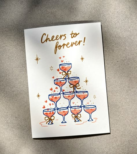 Share a toast to love and laughter with this "Cheers to Forever" greeting card. Featuring a softly illustrated champagne glass tower adorned with bows, this card is ideal for a wedding, engagement or anniversary. Send some sparkle to your favourite couple, and cheers to a lifetime of beautiful moments! 🥂✨ Blank inside for a personal message- A6 / 105 x 148mm - Printed in Australia on 100% recycled paper- Comes with a 100% recycled Kraft envelope and packaged in a recyclable cello bag - Sustaina Cute Wedding Cards Ideas, Cheers To Forever, Anniversary Card Diy For Him, Engagement Card Watercolour, Wedding Watercolour Card, Watercolor Engagement Card, Wedding Cards Handmade Marriage, Wedding Card Art, Homemade Engagement Cards