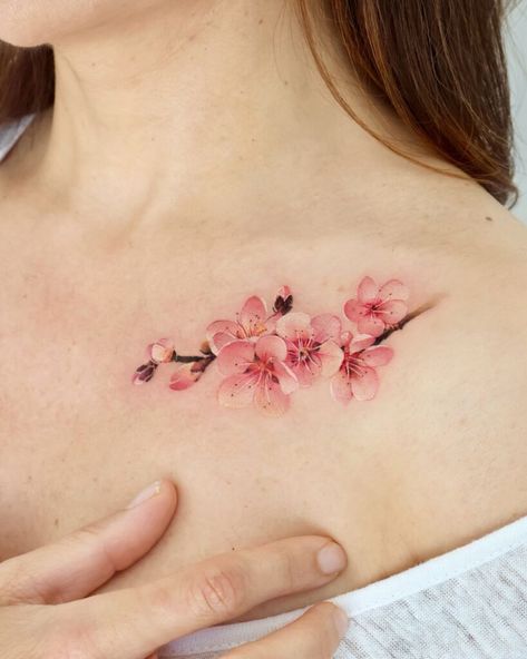 22 Cherry Blossom Tattoo Designs That Symbolize The Beauty Of New Beginnings Cherry Flowers Tattoo, Cherry Blossom Collar Bone Tattoo, Cherry Blossom Tattoo Stencil, Cherry Blossom Tattoo Shoulder, Pink Flower Tattoos, With Meaning Tattoo, Cherry Blossom Tattoos, Feminine Shoulder Tattoos, Bloom Tattoo