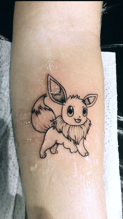 Simple Eevee Tattoo, Pokemon Tattoo Evie, Pokemon Tattoo Cute, Eevee Tattoo Ideas, Evee Tattoos, Eevee Tattoo Design, Pokemon Minimalist Tattoo, Tattoo Ideas Pokemon, Eevee Pokemon Tattoo