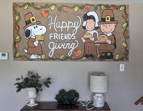 Hand painted Thanksgiving/Friendsgiving Charlie and Lucy and Snoopy brown Kraft paper banner sign. (This banner was a custom order, the wording can be changed to whatever you would like) My signs come in 2 sizes,  each of the signs are  approximately 23"x 6 feet or 3 feet x 6 feet.  Each sign can be left blank or can be personalized with wording of your choice. Once a purchase is made, I will message you a sketch of the wording you have chosen for your banner to ensure everything is perfect befo Thanksgiving Painted Banner Ideas, Brown Paper Banner Diy, School Thanksgiving Decorations, Thanksgiving Brown Paper Banner, Friendsgiving Poster Ideas, Friendsgiving Brown Paper Banner, Friendsgiving Banner Diy, Charlie Brown Friendsgiving, Thanksgiving Banner Ideas