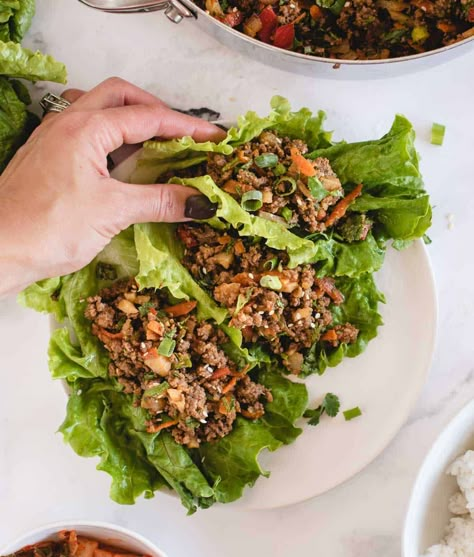 These quick-to-make ground beef lettuce wraps are loaded with savory ground beef and veggies doused in an umami-rich Asian-style soy ginger sauce! You can enjoy them with the beef filling nestled in crunchy lettuce as appetizers or snacks, or make them substantial enough for lunch or dinner by adding rice or grains. A fast ground beef dinner idea to add to you repertoire, the lettuce wraps come together in only 25 minutes, can be prepared ahead of time, and are easily made gluten free, too! Ground Beef Lettuce Wraps, Quick Pork Chop Recipes, Summer Time Meals, Chakra Foods, Soy Ginger Sauce, Easy Lettuce Wraps, Wraps Recipes Easy, Lettuce Wraps Healthy, Asian Lettuce Wraps