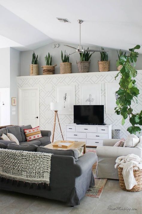 Snake Plant Basket Ledge, Plants On High Ledge, Plants On A Ledge, Grey Living Room With Plants, Vaulted Ceiling Shelf Decor Living Room, Decor For Ledge In Living Room, Vaulted Ceiling Ledge Decor Living Room, High Ledge Decor, Decorating Ledges In Living Room