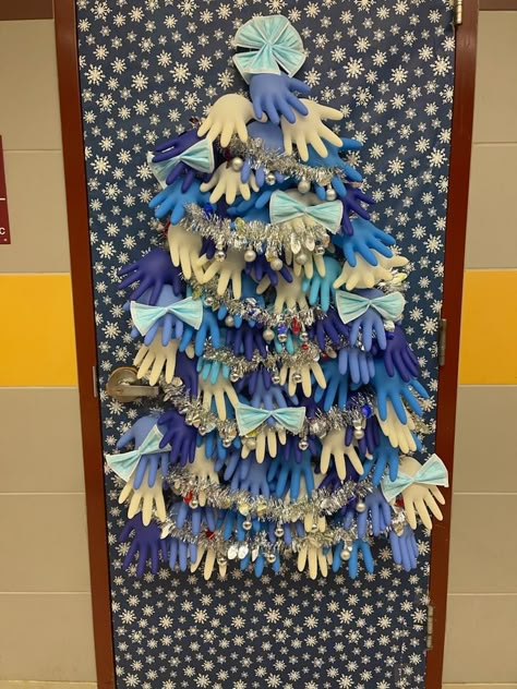 My husband is a school nurse. For his clinic door, he made a tree from surgical gloves and masks and plans to add band-aid boxes for gifts. :) Christmas Door Decorating Contest Nursing, Medical Office Door Decorating Contest, Christmas Door Decorations Medical, Nursing Home Door Decorations Christmas, Christmas Medical Office Decorations, Christmas Door Decorating Contest Hospital, Christmas Door Decorating Contest Medical Office, Medical Christmas Door Decorations, School Nurse Door Decoration Christmas