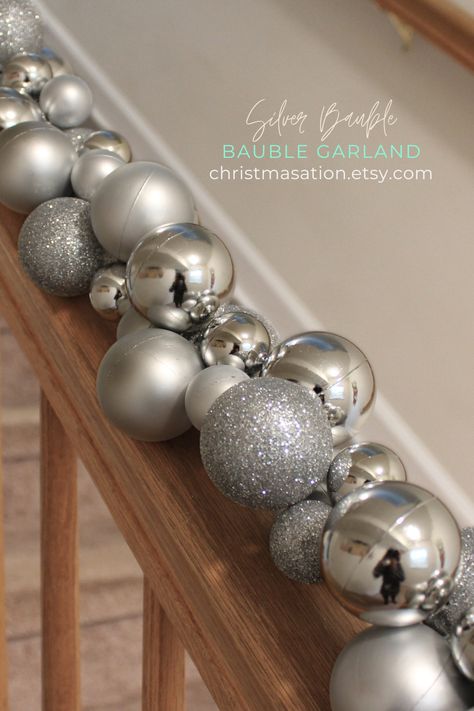 This exquisite Silver Bauble Garland features shiny, matte, and glittered ball ornaments. It can be used for any holiday or event decor, such as New Year's, weddings, Bridal showers, Bachelor or Bachelorette parties, birthday parties, baby showers, and more. It can be strung around a Christmas tree, on fireplace mantles, stair railings, around door and window frames, pews, side tables and more. Bauble Wreaths, Bauble Garland, Silver Baubles, Fireplace Mantles, Stair Railings, Christmas Dog Collar, Small Business Gifts, Shatterproof Ornaments, Party Garland