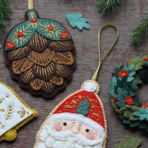 Kiriki Press on Instagram: "Orders are now open for the Advent Calendars! I’ve carefully crafted 12 festive and fun wool-blend felt kits that will keep you stitching all December long. So far, I’ve shared half of the designs with you. Each one is part of a set that remains a surprise until you unbox it on its special day. Every component is pre-cut and the embroidery patterns are printed directly onto the felt. This means you can produce these charming ornaments with around 45-60 minutes of crafting time per day. I absolutely love the entire collection... Some of my favourites are the “secret” ornaments. If you like what you see with these 6, I’m sure you will love to have all 12!" Green Felt Ornaments, Hand Embroidered Felt Ornaments, Cute Felt Ornaments, Felt Sewing Projects Free Pattern, 12 Days Of Christmas Felt Ornaments, Felt Stocking Ornaments, Felt Diy Christmas Ornaments, Felt Sweater Ornament, Felt Nutcracker Ornaments