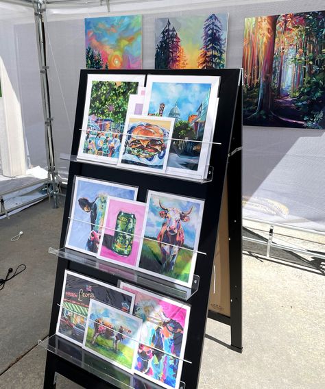 How to Create an Eye-Catching Print Rack for Your Art Fair Booth Art Display Stands Diy, Art Craft Fair Display, Craft Fair Diy Display, Art Show Print Display, Art Fair Print Display, Diy Display Wall Craft Fairs, Diy Art Display Craft Fairs, Renegade Craft Fair Booth, Art Print Display Stand