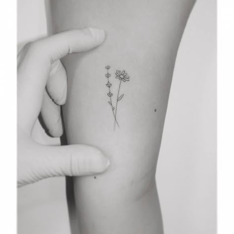 Small Daisy Rib Tattoo, Small Daisy Tattoo Color, Simply Daisy Tattoo, Daisy Initial Tattoo, Lavender And Flower Tattoo, Daisy And Lavender Bouquet Tattoo, Minimalist Daisy Tattoo Simple, Feminine Daisy Tattoos, Dainty Daisy Tattoo Wild Flowers