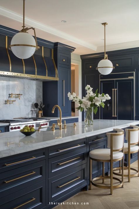 Luxurious kitchen with navy cabinets, gold accents, a marble countertop, and elegant pendant lights. Kitchen Sink In Island, French Blue Kitchen, Ivy Kitchen, Luxury Kitchen Designs, Modern Luxury Kitchen Design, Florida Kitchen, Kitchen Island With Sink, Unique Cabinet, Sink In Island