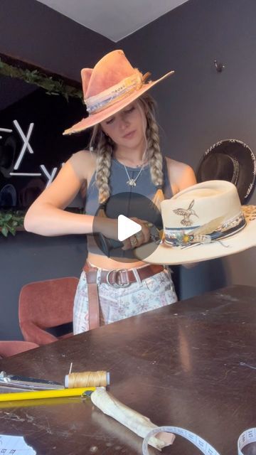 Alexa Wisnieski on Instagram: "Help me name this rose petal pinch silver-belly!  *custom order*  This beautiful custom included leopard print and a humming bird engraving with pops of teal, tans, browns and black bands. I absolutely loved working on this one!  . . #hatter #hatmaker #customhat #creativeprocess #process #nashville #nashvilletn #tn #tennessee #countrymusic #country #art #artist #handmade #customhat #millinery #milliner #tn #newmusic #satisfying #howitsmade #lexlynne" Cowgirl Hat Accessories, Cowgirl Hat Inspo Diy, Decorate Cowboy Hats Diy, Hat Decorating Ideas Creative, Bolero Hat Outfit, Decorating Cowboy Hats, Hairstyles With Cowboy Hats, Cowboy Hat Bands Diy, Womens Western Hat