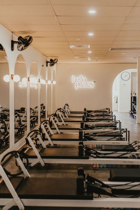 The owners had a clear vision of the relaxing vibe and calming space they wanted to create for their clientele. Soft textures, rendered curved walls, a neutral colour palette, bespoke lighting, and neon signage helped to achieve a restful retreat vibe with a modern feel.
Lighting was key to the design. Bespoke neon branded signage, spotlights, and a feature sunrise motif wall light really brought the space together, creating ambience and atmosphere. Baking Makeup Technique, Pilates Studio Design Interiors, Holistic Fitness, Fitness Retreat, Neon Signage, Wellness Studio, Calming Spaces, Studio Interior Design, Bespoke Lighting