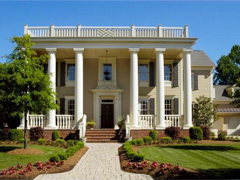 Inspired by Greek architecture and democracy, Greek revival homes feature a symmetrical, formal shape. Learn more about Greek architecture on HGTV.com. Greek Exterior, Greek Revival House Plans, Greek Revival Farmhouse, Architecture Wallpapers, Architecture Tips, Exterior Columns, Furniture Picture, Greek Revival Architecture, Greek Home