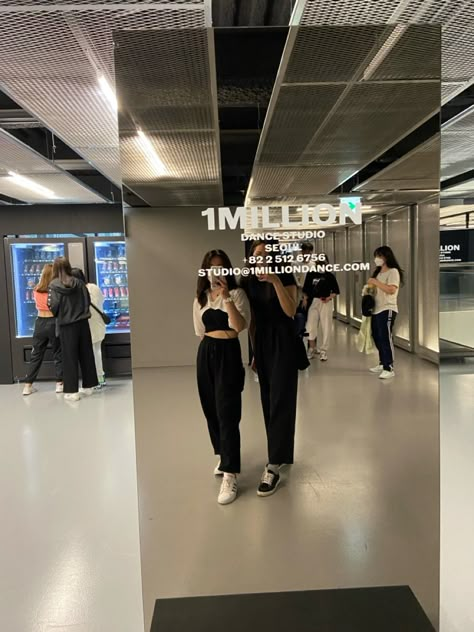 dancer dressed in black sweatpants and white croptop poses in front of mirror for a mirror selfie at 1million dance studio in seoul, south korea Korean Dance Studio, Korean Vision Board, Korea Vision Board, Dancer Vision Board, Vision Board Hobbies, Kpop Vision Board, Dance Vision Board, 1 Million Dance Studio, Dancer Vibes