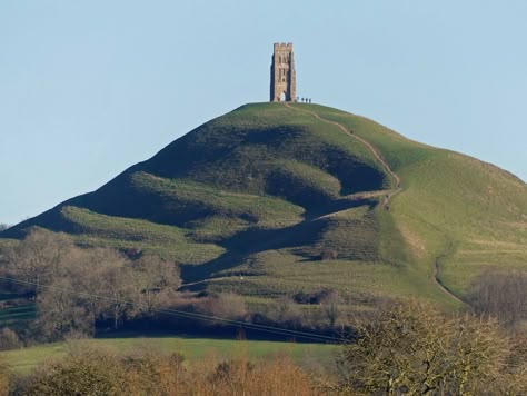 Glastonbury Tor, Somerset in winter sunshine Glastonbury Abbey, Winter Sunshine, Glastonbury Tor, England Countryside, England Aesthetic, Ancient Places, Somerset England, Dnd Campaign, Forest Path