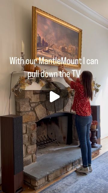 Andrea on Instagram: "There was one spot to put a tv in our living room and that was above the fireplace. The fireplace is tall and deep so it made the tv too high to view comfortably. With our MantleMount at @bestbuy we are able to pull the tv down to a comfortable viewing height, it clears my seasonal decor and is easy to put back up. Since we have gas logs, it’s to turn the fire off when we want to watch tv or we just put it back up. However, the fireplace installer also said we could probably watch tv (just not the whole day) with a fire going since it’s a full two feet from the fire and the mantle is 12” deep so it blocks most of the heat. Having the ability to pull the tv down and turn it to whichever angle we want is perfect! It allows for a functional and beautiful install of our Fireplace Tv Opposite Walls, What To Do With Tv Hole Above Fireplace, Tv On Fireplace Ideas, Living Room Gas Fireplace With Tv, Tv On Mantle Decor, Projector Above Fireplace, Big Tv Above Fireplace, Picture Tv Above Fireplace, Pull Down Tv Over Fireplace