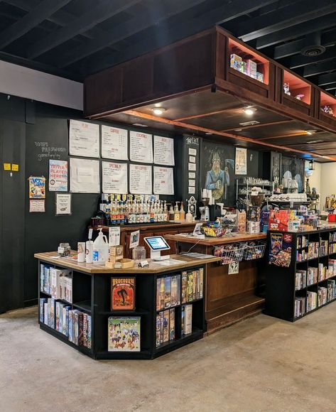 How-To Spielbound | Spielbound Board Game Cafe Game Store Interior Design, Board Games Coffee Shop, Board Game Cafe Aesthetic, Board Games Bar, Game Shop Aesthetic, Game Cafe Design Interior, Board Game Bookshelf, Cozy Board Game Room, Board Game Cafe Interior