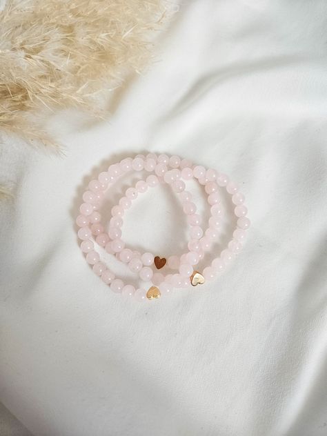 The newest addition to our mini heart stacker series! 6mm genuine rose quartz gemstone beads Gold hematite heart Stretch bracelet. Made to order.