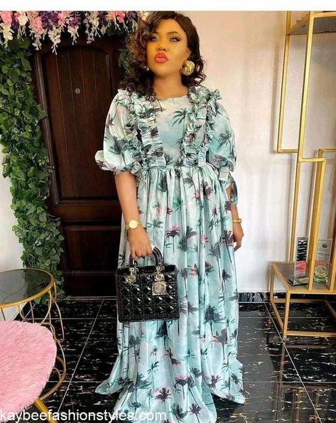 30 Best Flower Chiffon Gown Styles in Nigeria - Kaybee Fashion Styles Material Long Gown Styles In Nigeria, Flower Chiffon Gown Styles In Nigeria, Chiffon Gown Styles In Nigeria, Flowered Chiffon Gown Styles, Material Gown Styles For Ladies, Flower Material Gown Styles, Chiffon Short Gown Styles, Simple Chiffon Short Gowns, Chiffon Bubu Gown Styles