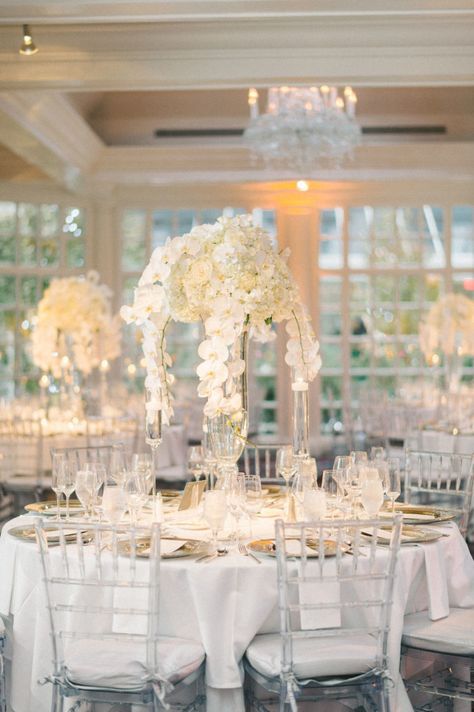 Glass Chairs Wedding, All White Wedding Reception, White Orchid Centerpiece, Orchid Centerpieces Wedding, Disney Wedding Centerpieces, Catholic Traditions, Classic Wedding Reception, White Centerpieces, Wedding Space