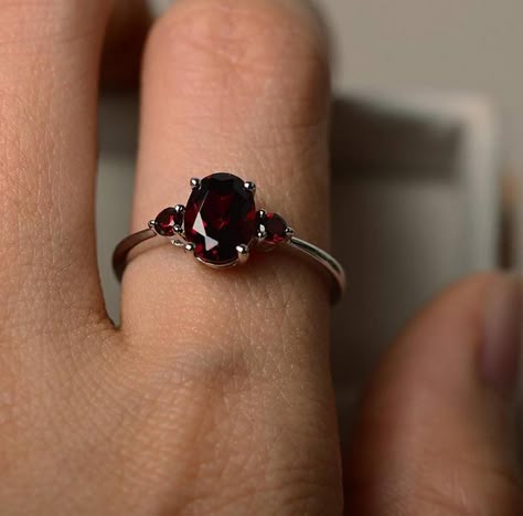 This Art Deco Oval shape garnet ring can be a good choice for engagement ring. The vintage style design makes it noble and delicate. A great gift for your loved one! Features * Made to Order. * Material: 925 Silver. * Color: Silver. * Stone Type: Natural Red Garnet.  * Stone Size: 6x8MM. * Stone Shape: Oval.  * Ready to Ship in 7-10 Business Days.  Want to find out more? Check out my shop https://www.etsy.com/shop/EARTHLYpiecesIndia Thank you for taking the time to look at my shop. I hope you en Garnet Stone Ring, January Birthstone Rings, Red Garnet Ring, Cubic Zirconia Engagement Rings, Ring Birthstone, Garnet Ring, Garnet Stone, 925 Silver Ring, Ring Oval